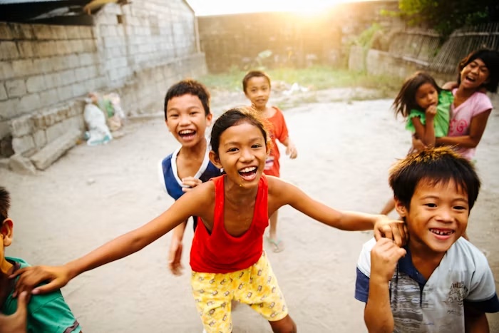 Children smiling together outdoors